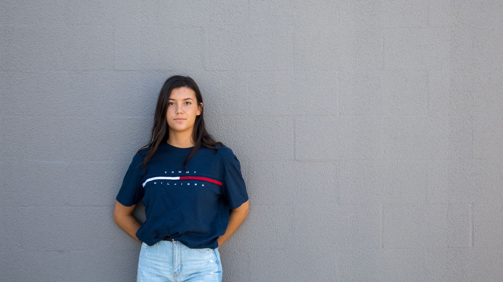 a woman wearing a Tommy Hilfiger t-shirt