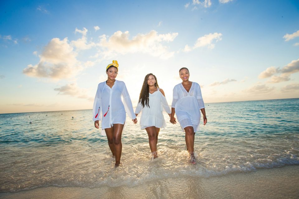 Three women wearing resort fashion white cover-ups