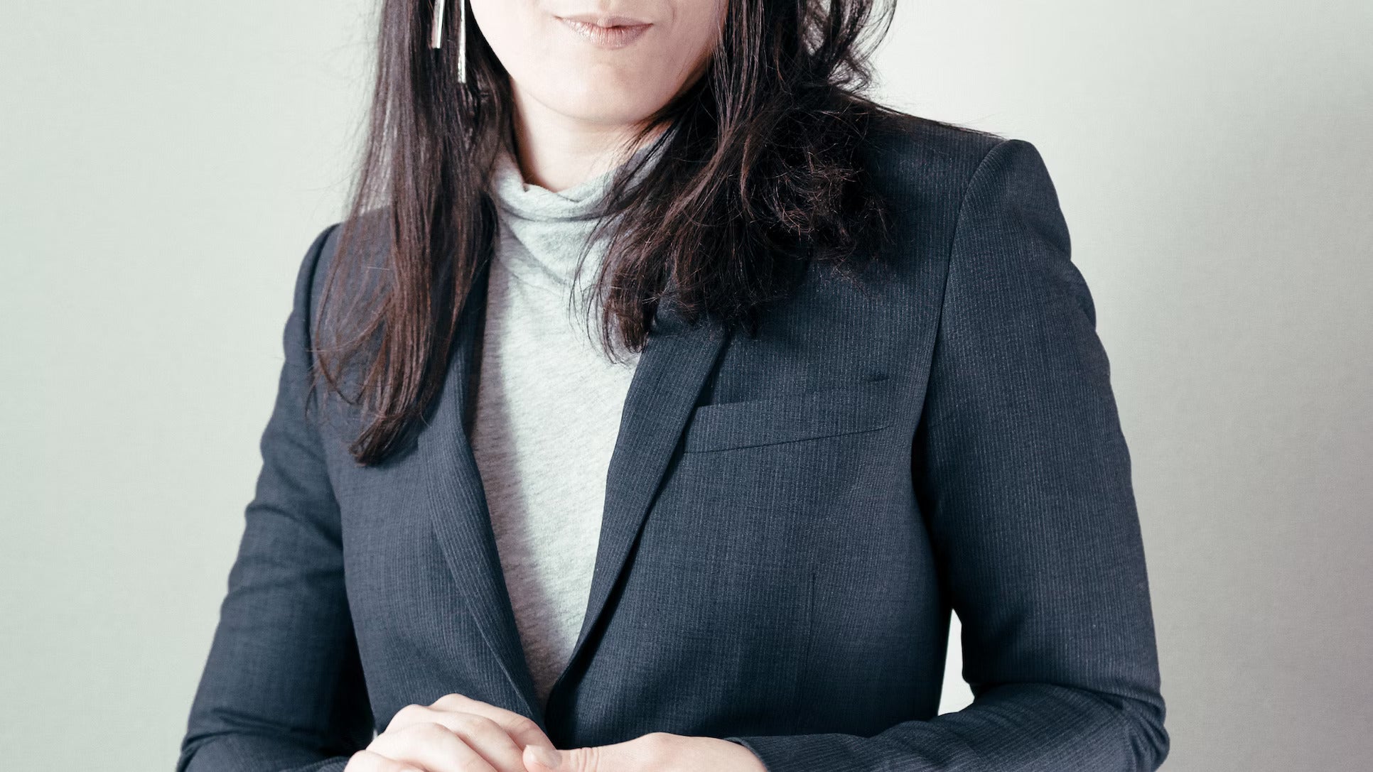 Close-up of the top of a woman’s trendy business casual outfit