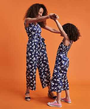 Mother and daughter in matching family set clothing